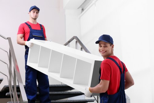 Moving team handling boxes and furniture for a Haringey relocation