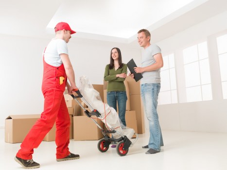 Commercial moving team handling office furniture