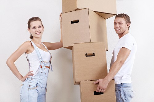 Packed moving boxes and furniture ready for transport in Haringey